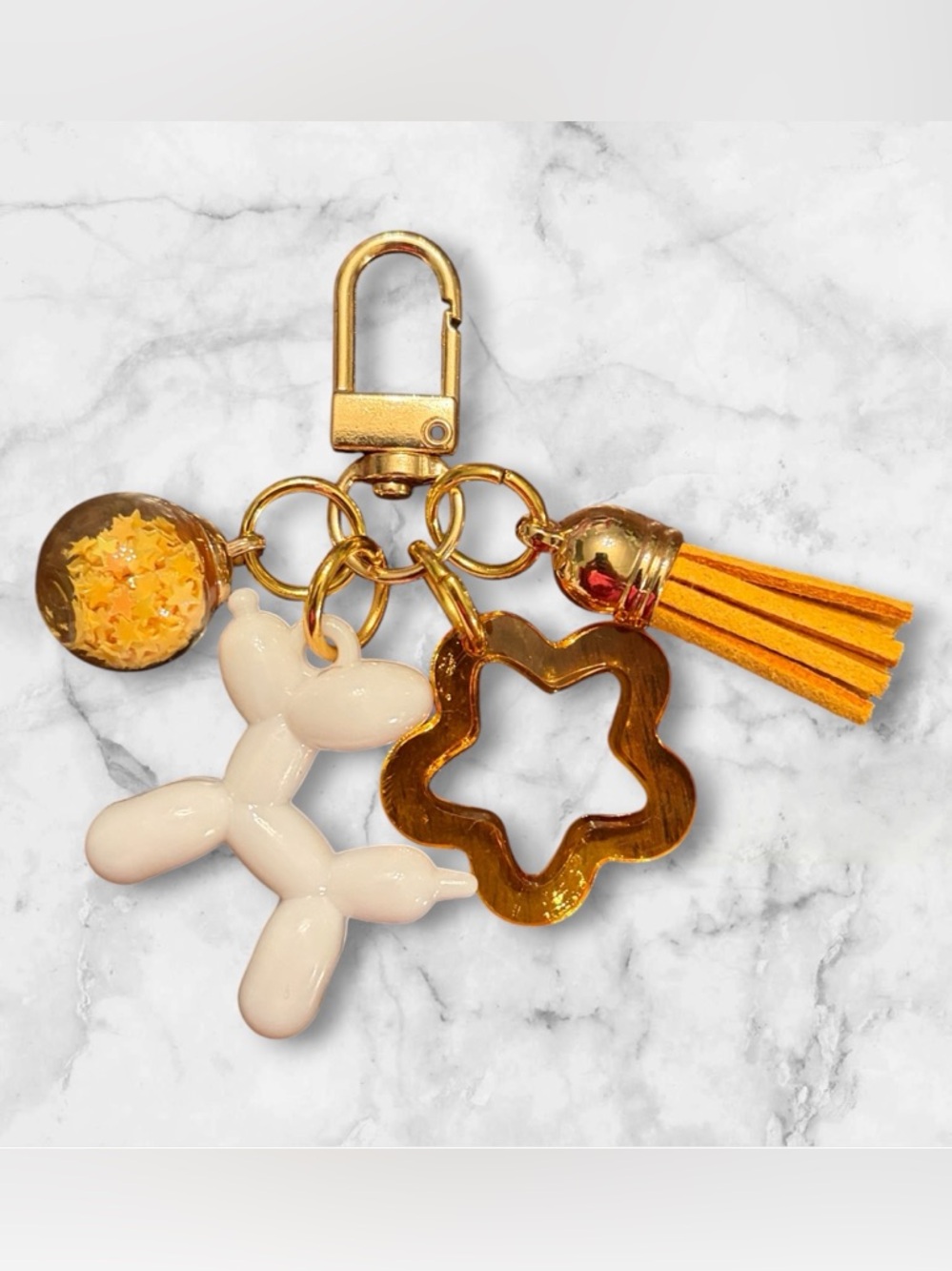 Gold-tone Balloon Dog Keychain with Yellow Tassel